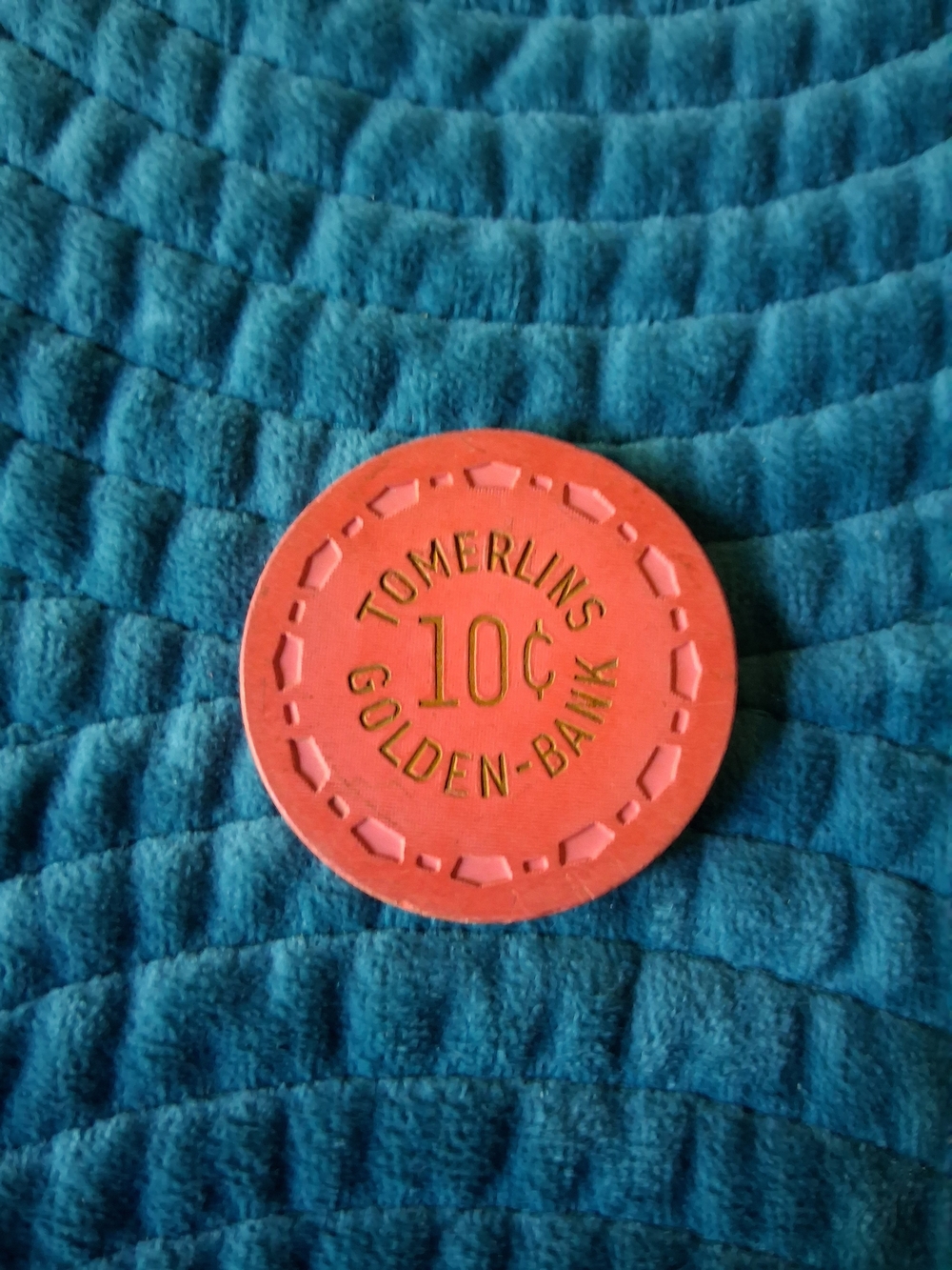 1950s Tomerlin's Golden Bank Club 10-cent casino chip from Reno, Nevada.